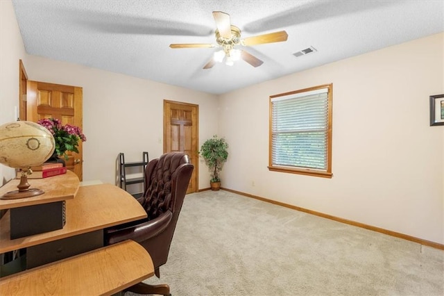12806 Goddard Ave, Overland Park, KS 66213 - home office with carpet flooring, ceiling fan, baseboards, and a textured ceiling