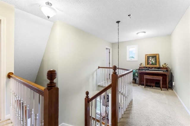 12806 Goddard Ave, Overland Park, KS 66213 - hall featuring an upstairs landing, carpet flooring, a textured ceiling, and baseboards