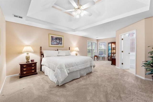 12806 Goddard Ave, Overland Park, KS 66213 - carpeted bedroom with a tray ceiling, baseboards, ensuite bath, and ceiling fan