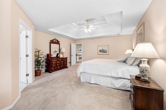 12806 Goddard Ave, Overland Park, KS 66213 - carpeted bedroom featuring a tray ceiling and a ceiling fan