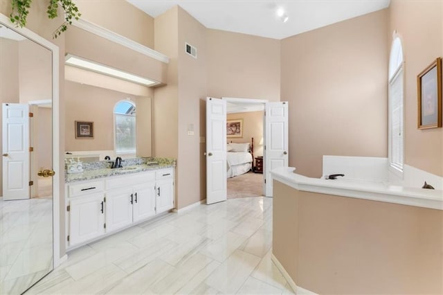 12806 Goddard Ave, Overland Park, KS 66213 - ensuite bathroom featuring vanity and a bath
