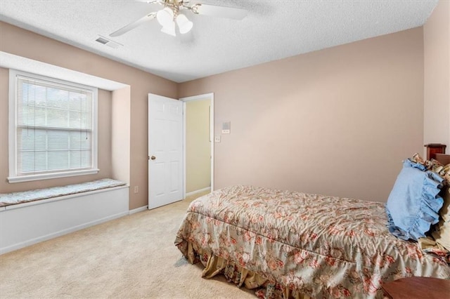 12806 Goddard Ave, Overland Park, KS 66213 - bedroom featuring a textured ceiling, carpet, baseboards, and ceiling fan