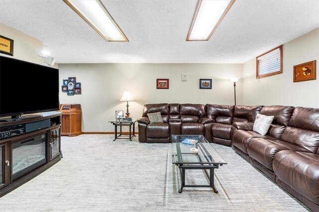 12806 Goddard Ave, Overland Park, KS 66213 - living area with baseboards, light colored carpet, and a textured ceiling