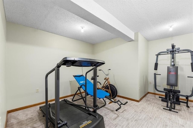 12806 Goddard Ave, Overland Park, KS 66213 - exercise room with a textured ceiling, baseboards, and carpet