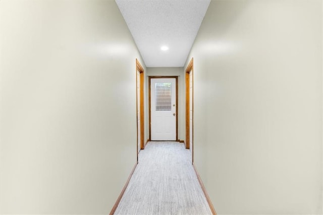 12806 Goddard Ave, Overland Park, KS 66213 - hallway featuring baseboards and light carpet
