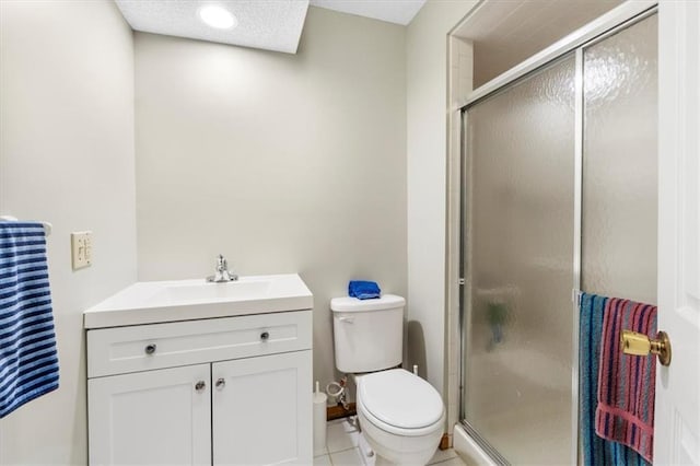 12806 Goddard Ave, Overland Park, KS 66213 - full bath with a shower stall, toilet, vanity, and tile patterned flooring