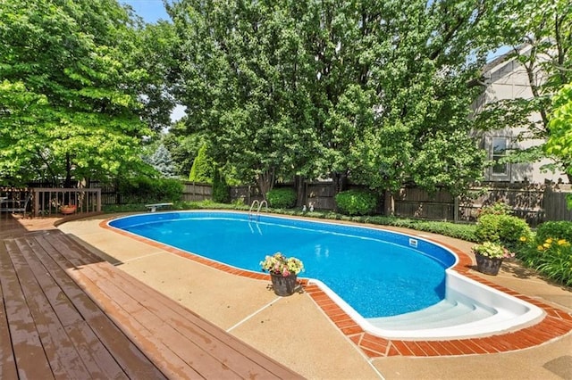 12806 Goddard Ave, Overland Park, KS 66213 - view of pool featuring a wooden deck and a fenced backyard