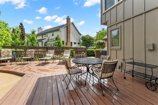 12806 Goddard Ave, Overland Park, KS 66213 - wooden deck with outdoor dining space