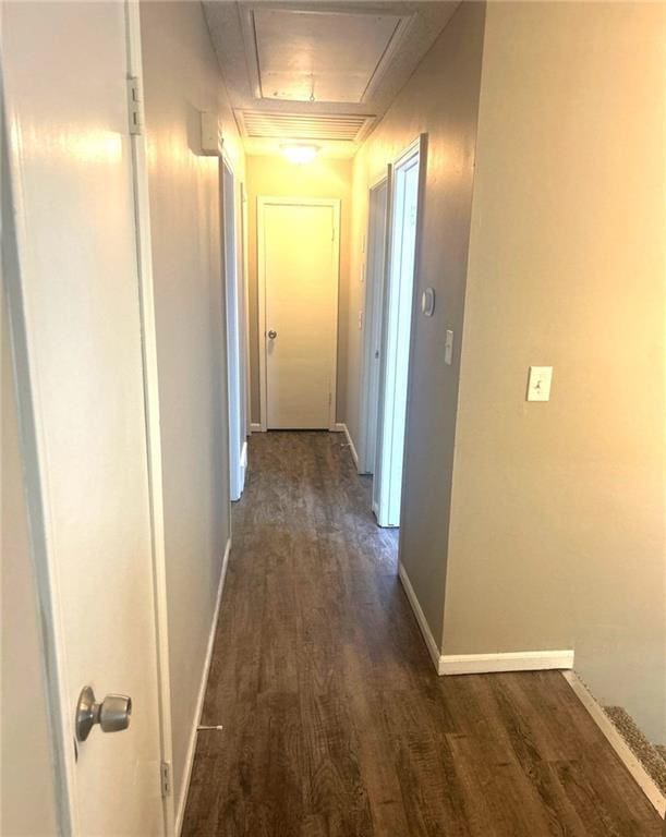 10636 N Grand Ave, Kansas City, MO 64155 - hallway with dark wood finished floors, baseboards, and attic access