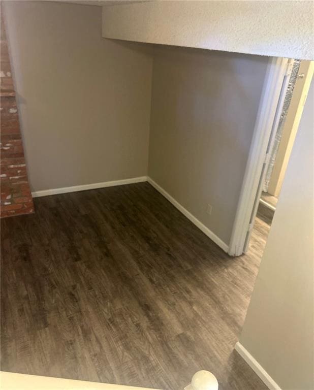 10636 N Grand Ave, Kansas City, MO 64155 - unfurnished room featuring wood finished floors and baseboards