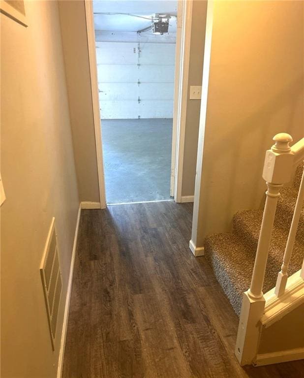 10636 N Grand Ave, Kansas City, MO 64155 - corridor with wood finished floors, stairs, and baseboards
