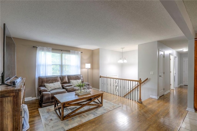 606 W Smith St, Spring Hill, KS 66083 - living area featuring a textured ceiling and wood finished floors