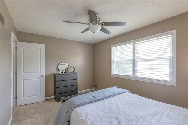 606 W Smith St, Spring Hill, KS 66083 - carpeted bedroom with ceiling fan and a textured ceiling