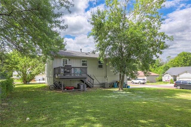 606 W Smith St, Spring Hill, KS 66083 - rear view of house with a deck, a yard, and stairway
