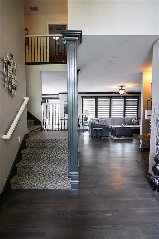 3832 SW Boulder Dr, Lees Summit, MO 64082 - stairs with wood finished floors and ornate columns
