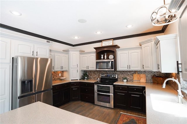 3832 SW Boulder Dr, Lees Summit, MO 64082 - kitchen featuring stainless steel appliances, dark wood-style floors, white cabinetry, a sink, and light countertops