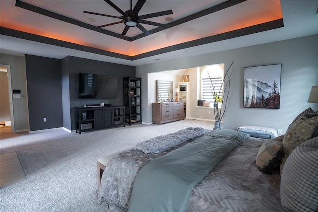 3832 SW Boulder Dr, Lees Summit, MO 64082 - carpeted bedroom featuring a tray ceiling and baseboards