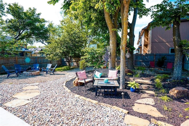 3832 SW Boulder Dr, Lees Summit, MO 64082 - fenced backyard with an outdoor fire pit and a patio area