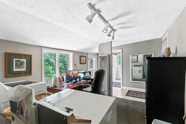 6246 Woodland Dr, Shawnee, KS 66218 - tiled office space featuring a textured ceiling, track lighting, and baseboards