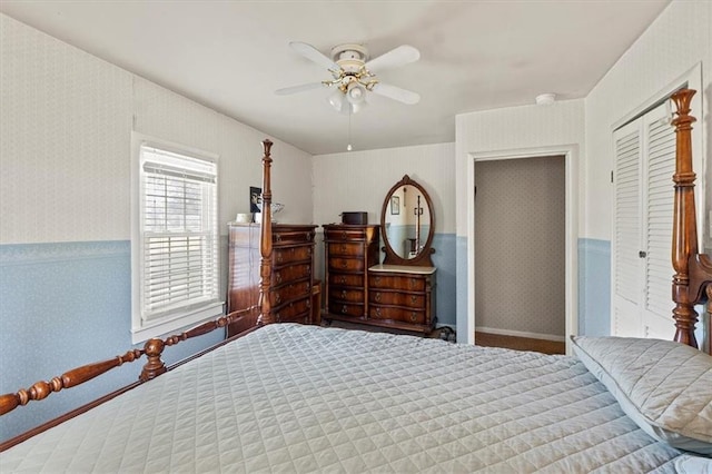 6246 Woodland Dr, Shawnee, KS 66218 - bedroom featuring a ceiling fan, carpet flooring, a closet, wallpapered walls, and wainscoting