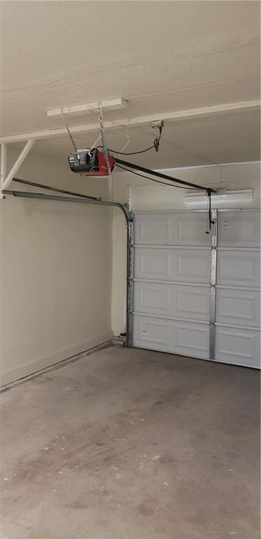 306 Morningside Dr, Richmond, MO 64085 - garage featuring a garage door opener
