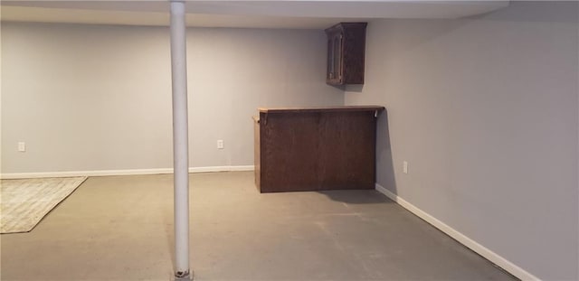 306 Morningside Dr, Richmond, MO 64085 - finished basement with baseboards and a bar