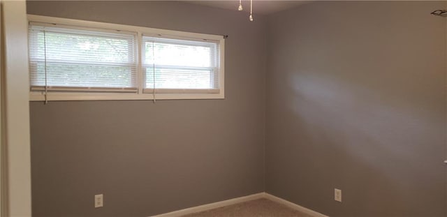 306 Morningside Dr, Richmond, MO 64085 - carpeted empty room featuring baseboards