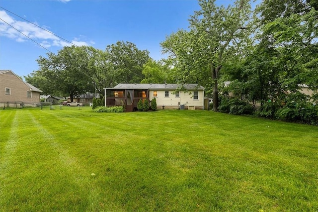 8632 Larsen St, Overland Park, KS 66214 - view of yard featuring a wooden deck