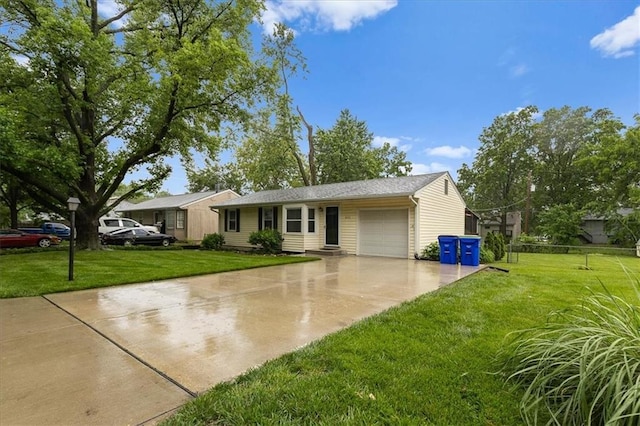 8632 Larsen St, Overland Park, KS 66214 - single story home with concrete driveway, an attached garage, and a front lawn