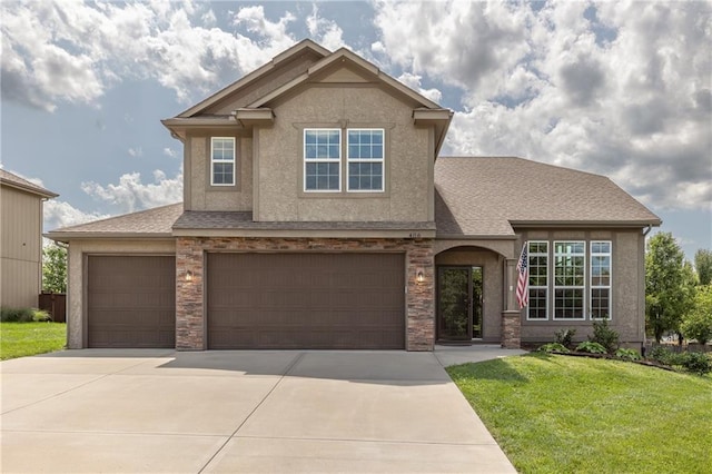 486 S 137th Pl, Bonner Springs, KS 66012 - view of front of house featuring a front lawn, concrete driveway, stucco siding, and a garage