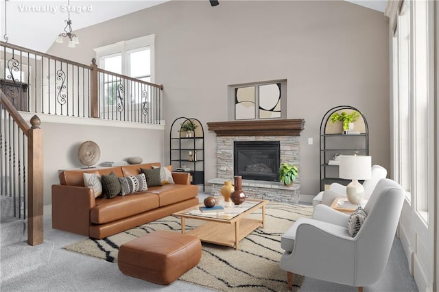 486 S 137th Pl, Bonner Springs, KS 66012 - living room with a high ceiling, carpet flooring, and a fireplace