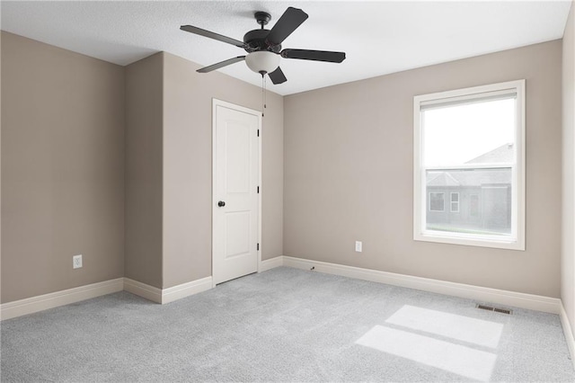 486 S 137th Pl, Bonner Springs, KS 66012 - empty room with light colored carpet, baseboards, and a ceiling fan