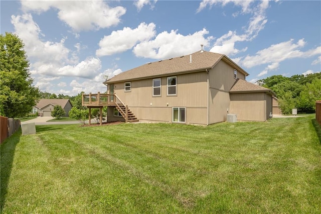 486 S 137th Pl, Bonner Springs, KS 66012 - rear view of property featuring stairs, a deck, cooling unit, a yard, and roof with shingles