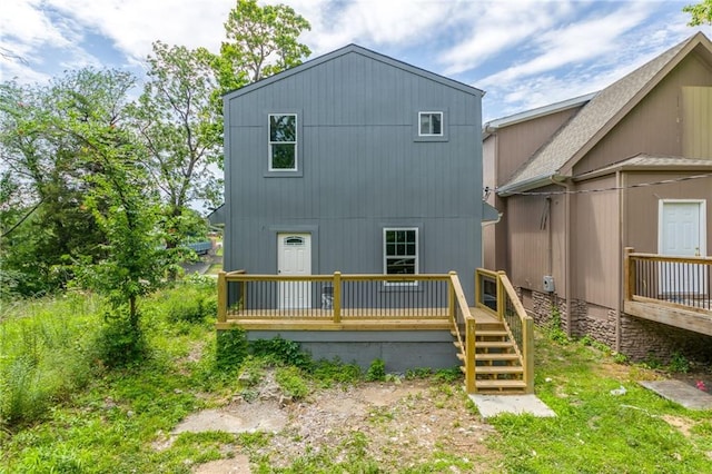 4233 Euclid Ave, Kansas City, MO 64130 - back of property with a wooden deck