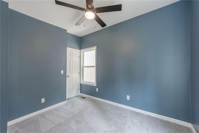 4233 Euclid Ave, Kansas City, MO 64130 - empty room featuring baseboards, a ceiling fan, and carpet floors