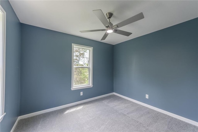 4233 Euclid Ave, Kansas City, MO 64130 - carpeted spare room with baseboards and a ceiling fan