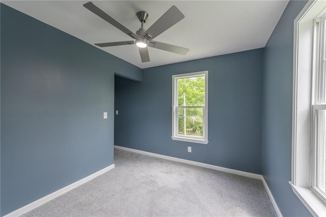 4233 Euclid Ave, Kansas City, MO 64130 - carpeted spare room featuring ceiling fan and baseboards