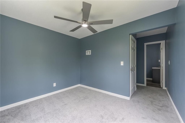 4233 Euclid Ave, Kansas City, MO 64130 - carpeted empty room featuring ceiling fan and baseboards