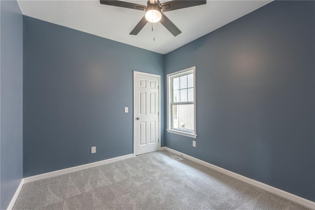 4233 Euclid Ave, Kansas City, MO 64130 - empty room with carpet flooring, baseboards, and ceiling fan