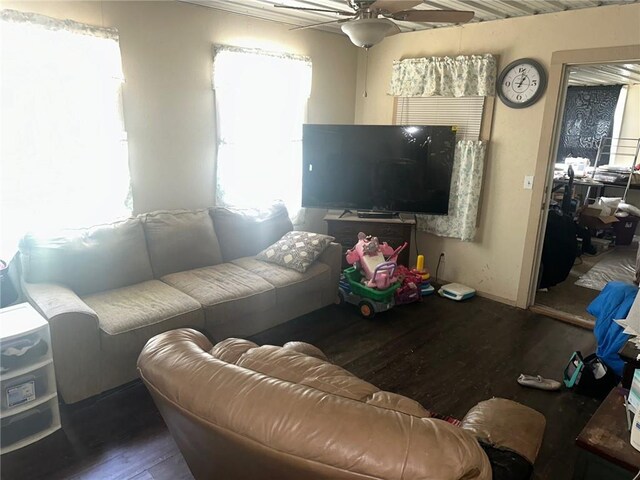 63 Clark Rd, Mapleton, KS 66754 - living room featuring wood finished floors, a ceiling fan, and baseboards