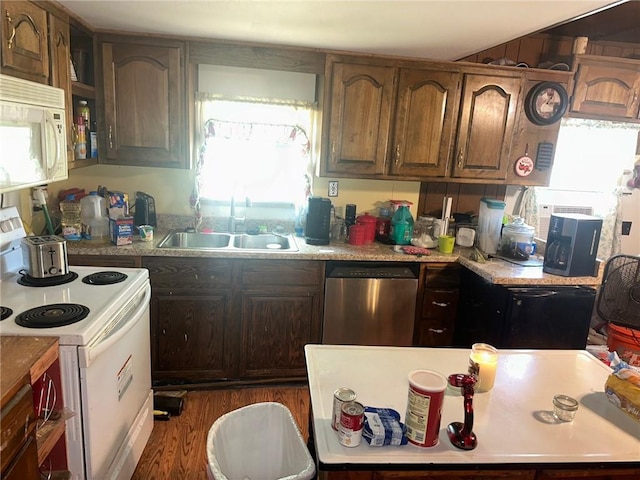 63 Clark Rd, Mapleton, KS 66754 - kitchen with white appliances, a sink, light countertops, and wood finished floors