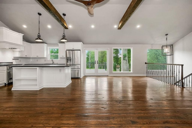 2308 W 95th St, Leawood, KS 66206 - kitchen featuring stainless steel appliances, dark countertops, decorative backsplash, open shelves, and white cabinetry