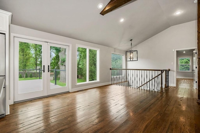 2308 W 95th St, Leawood, KS 66206 - unfurnished room with lofted ceiling, hardwood / wood-style flooring, and a chandelier