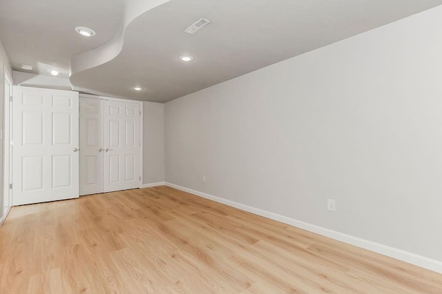 2308 W 95th St, Leawood, KS 66206 - unfurnished bedroom with light wood finished floors, recessed lighting, and a closet