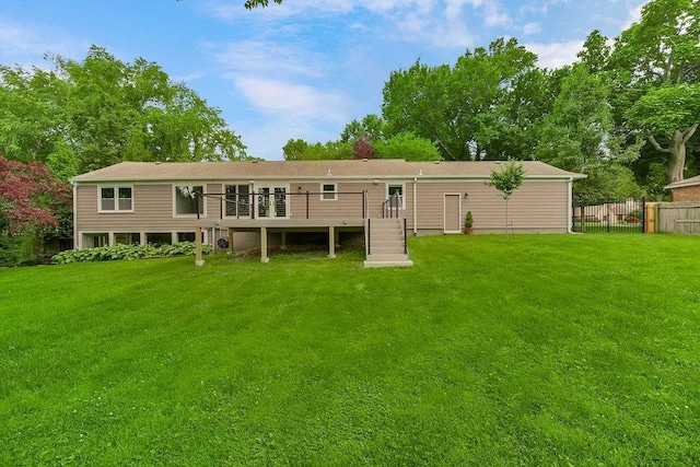 2308 W 95th St, Leawood, KS 66206 - back of property with a wooden deck, stairway, and a chimney