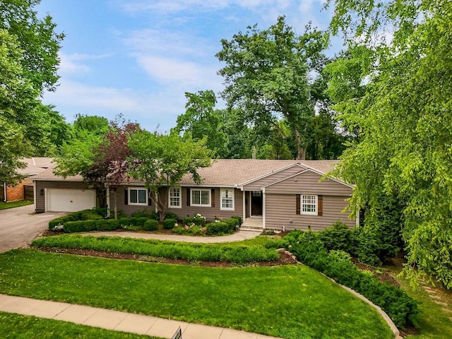 2308 W 95th St, Leawood, KS 66206 - ranch-style house featuring driveway, a garage, and a front yard
