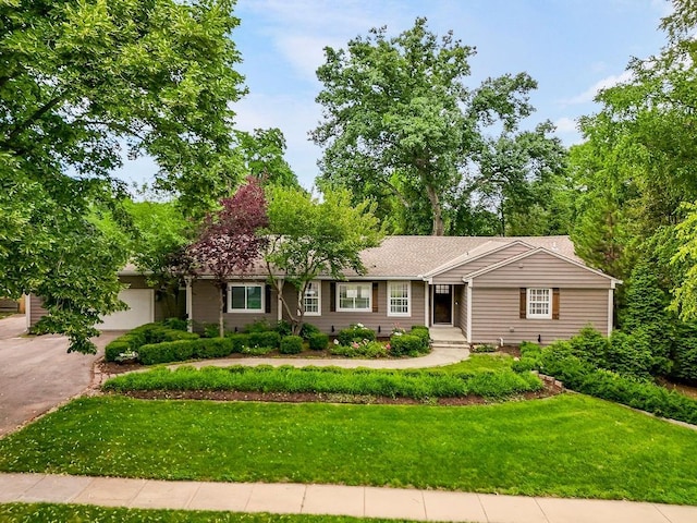 2308 W 95th St, Leawood, KS 66206 - ranch-style house featuring a front lawn and driveway
