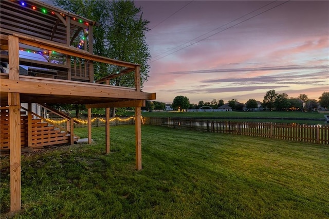5916 NE Turquoise Dr, Lees Summit, MO 64064 - view of yard featuring stairway and a deck with water view
