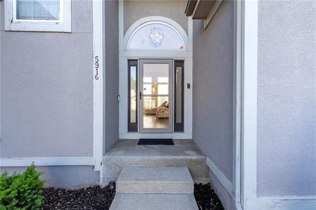 5916 NE Turquoise Dr, Lees Summit, MO 64064 - property entrance featuring stucco siding