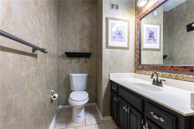 5916 NE Turquoise Dr, Lees Summit, MO 64064 - bathroom with toilet, vanity, tile patterned floors, and baseboards